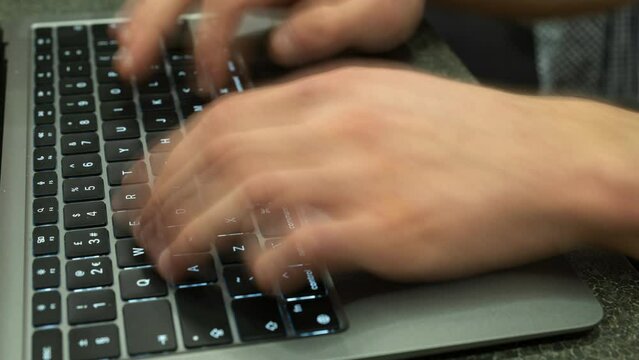 Timelapse of caucasian man typing on laptop  