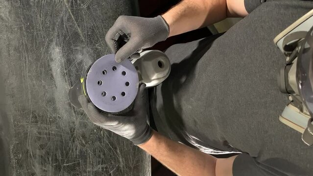 working with fiberglass. sandpaper.emery wheel.install sandpaper. vertical video. slow motion video. High quality video in 4K format.