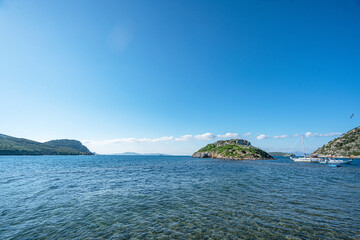 The scenic views from Gümüşlük bay with yachts in Bodrum, Turkey