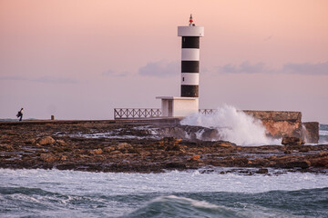 strong waves on the Puntassa lighthouse in Colònia de Sant Jordi, ses Salines, Mallorca, Balearic...