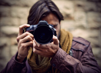 Photographer, work and man in city as paparazzi, filming and memory of travel or adventure for...