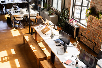 A modern casual business office space bathed in natural light