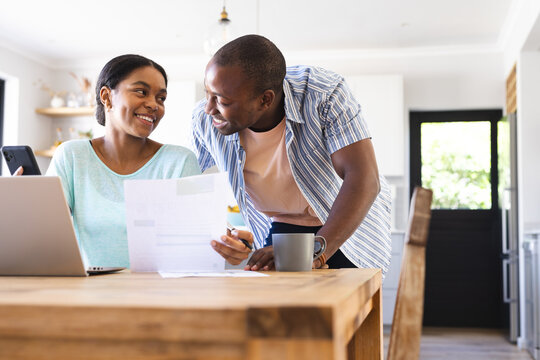 Biracial couple reviews finances at home