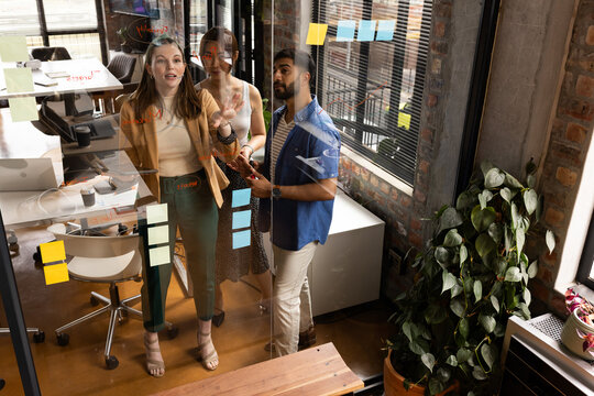 Casual business diverse team brainstorming in a modern office