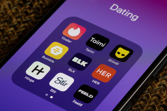 Redmond, WA, USA - Jan 13, 2024: Assorted dating apps, including Tinder, Taimi, Grindr, Bumble, BLK, HER, Hinge, Stir, and Feeld, are seen on an iPhone.