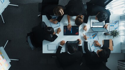 Top view of smart business people brainstorm marketing idea at meeting table while compare stock market investment data between laptop and tablet. Business team planning financial plan. Directorate.