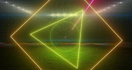 Image of rotating neon shapes and lights over floodlit sports field