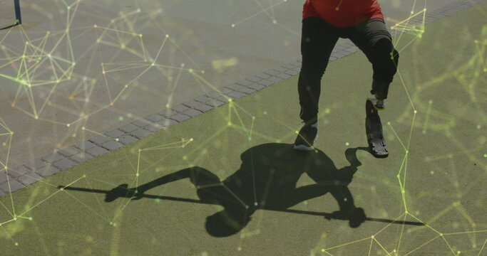 Image of yellow communication network over male athlete with running blade lifting weights