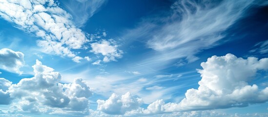 A natural landscape with electric blue sky, fluffy white cumulus clouds, and wind gently blowing...