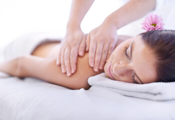 Relax, massage and woman at hotel spa with flower for health, wellness and luxury holistic treatment. Self care, peace and girl on table with masseuse for body therapy, sleep and calm service.