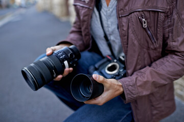 Camera lens, outdoor and hands of photographer to work in city on photoshoot with professional gear...