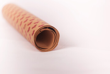Paper roll, wrapping paper on a white background with  red hearts