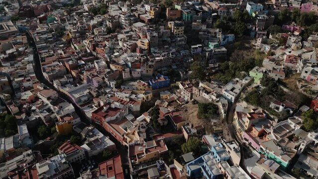 Drone Flies Above Guanajuato City Center in Mexico during Daytime: Catholic Church, University Buildings