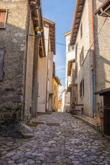 Obraz premium Old residential buildings in the historic hill village of Timau in Udine Province, Friuli-Venezia Giulia, North East Italy. Part of the Paluzza municipality, Val But, Carnia Alps