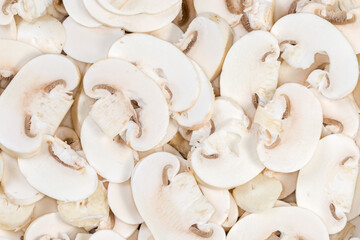 Background of the daw sliced button mushrooms, top view