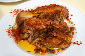 Close up Perna de Cerdo, Roasted pork legs- Traditional classic Spanish Tapas