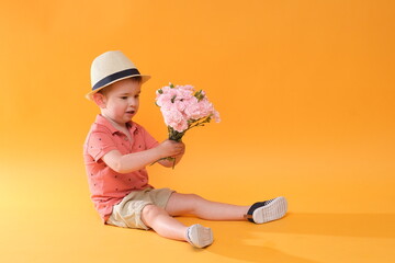 Little boy with a bouquet of flowers. © forma82
