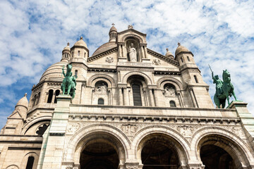 Fototapeta na wymiar Church of Sacre Coer in Paris, France, Close up view at facade at sunny day