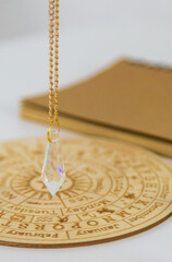 Pendulum numerologist astrologer and zodiac signs. Selective focus.