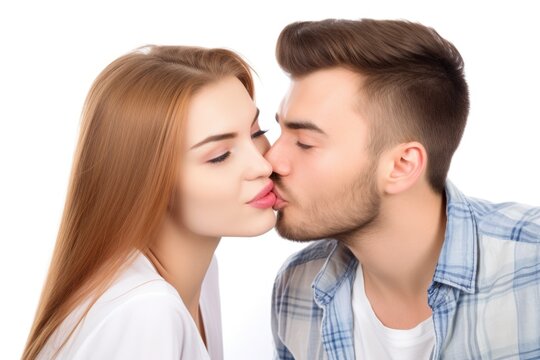 studio shot of a young man kissing his girlfriend on the cheek isolated on white