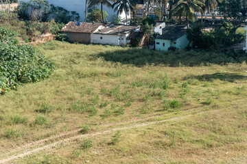 Picturesque Field With House and Trees in Hassan, Karnataka