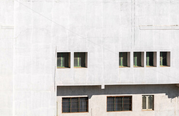 Fototapeta na wymiar White Building With Window Bars
