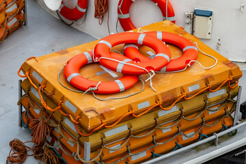 Looking down at life rafts and life buoys on a boat