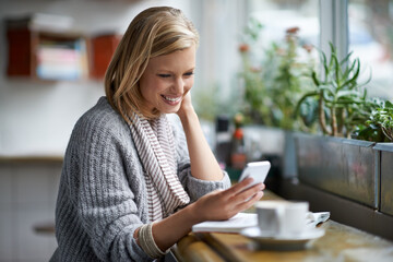 Phone, happy and woman with drink in coffee shop online for social media, text message and internet. Restaurant, cafe and person on smartphone laugh for website, reading blog and chat with cappuccino