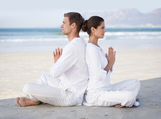 Couple, yoga and beach with meditation, sitting and peace on sand in morning with mindfulness in summer. Man, woman and outdoor for namaste with spiritual growth, balance or zen by ocean in Cape Town