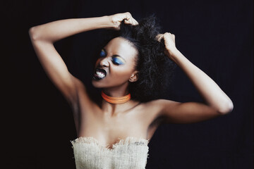 Naklejka premium Beauty, hair care and frustrated black woman on dark background for hairstyle, texture and natural afro. Stress, salon crisis and angry African person with cosmetics, accessories and makeup in studio