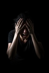 fear, mental health and stress with a person in the dark isolated on a studio background