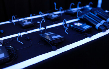 Clip-on microphones ready in the backstage area of a TV production