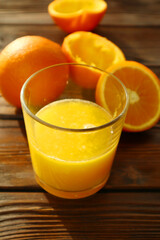  Fresh ripe juicy oranges on wooden background   