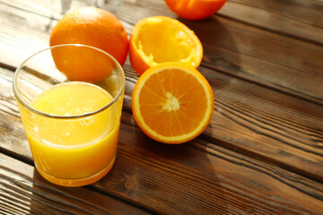  Fresh ripe juicy oranges on wooden background   