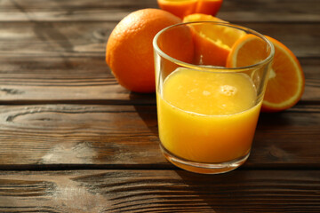  Fresh ripe juicy oranges on wooden background   