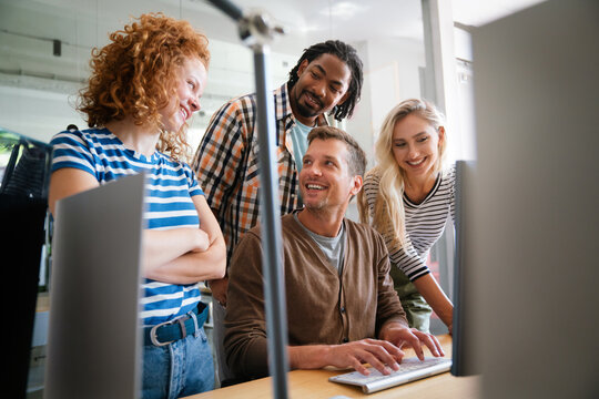 Programmers working in a software developing company office