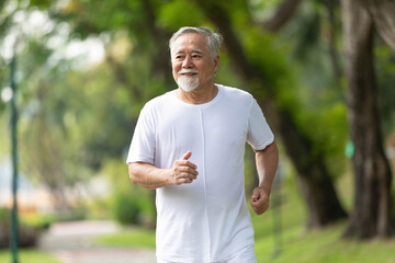 senior man running and exercising in the park