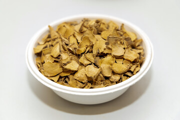 Dry plai (Zingiber cassumunar) sliced in bowl ingredient herb for herbal alternative medicine.