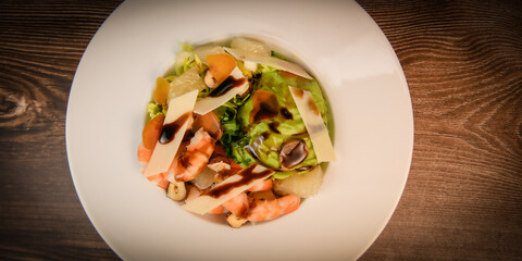 RECIPE FOR MIXED SALAD OF BOTTARGA AVOCADO SHRIMP CHINESE GRAPEFRUIT, SUCRINE SALAD, PARMESAN, HAZELNUT, BALSAMIC VINAIGRETTE. High quality photo