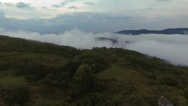 Aerial video of fog in the mountains.