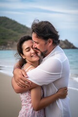 Fototapeta na wymiar love, couple and happy with a hug at the beach for love, romance and affectionate together