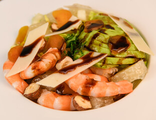 RECIPE FOR MIXED SALAD OF BOTTARGA AVOCADO SHRIMP CHINESE GRAPEFRUIT, SUCRINE SALAD, PARMESAN, HAZELNUT, BALSAMIC VINAIGRETTE. High quality photo