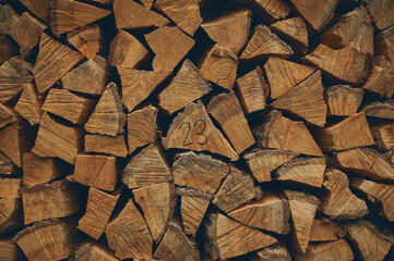 stacked firewood from 2023. High quality photo
