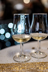 Small tasting glasses of sparkling wine champagne on winter festival in December, Avenue de Champagne, Epernay, Champagne region, France