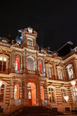 Fototapeta na wymiar Illuminated glass windows of traditional French house at night, Epernay, Champagne, France