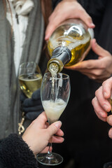 Visitors drink of sparkling wine champagne on outdoor winter festival in December on Avenue de Champagne, Epernay, Champagne region, France