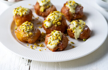 Sicilian Pistachio Cream Fritelle on Textured White Plate