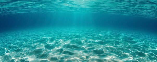 Clear and calm underwater view with the sun glowing brightly through the ocean water