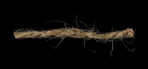 Close up piece of rope isolated on black, macro