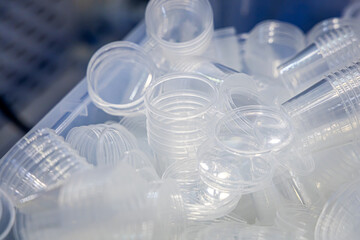 Factory for the production of plastic packaging. Lots of transparent plastic containers with lids. Plastic food packaging. Plastic molding